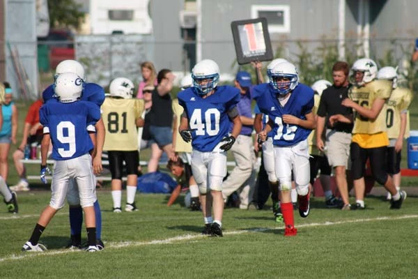 Football players coming into a game