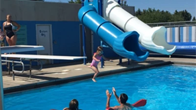 Girl jumping into the pool