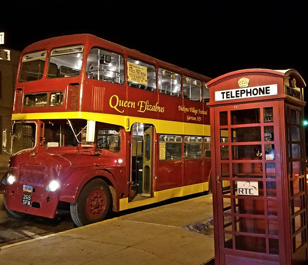 Bus with a phone booth in view.