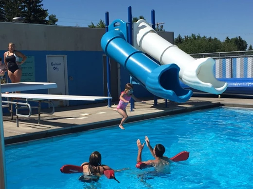 Girl jumping into the pool